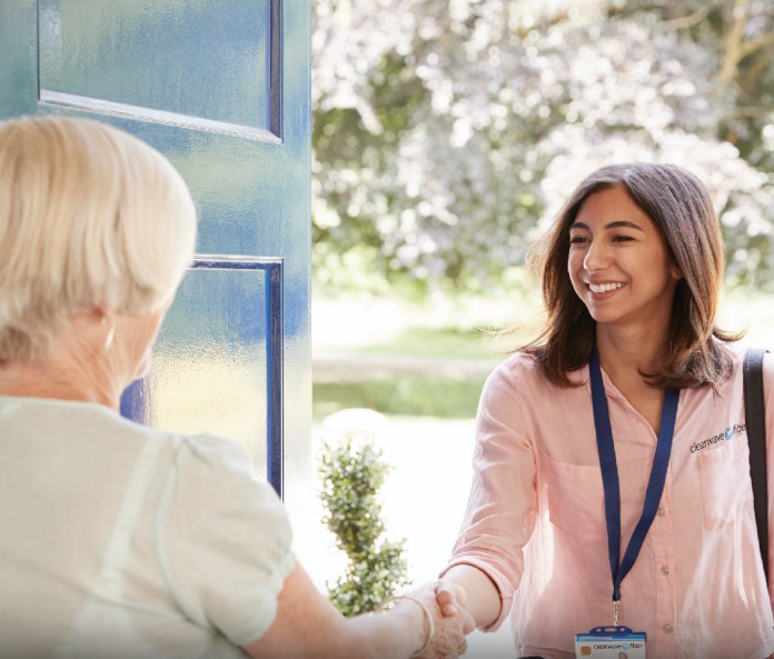 Clearwave associate shaking hands with home owner.